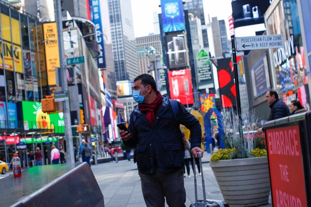 A man wearing a face mask visits New York’s Times Square. Photo: AFP