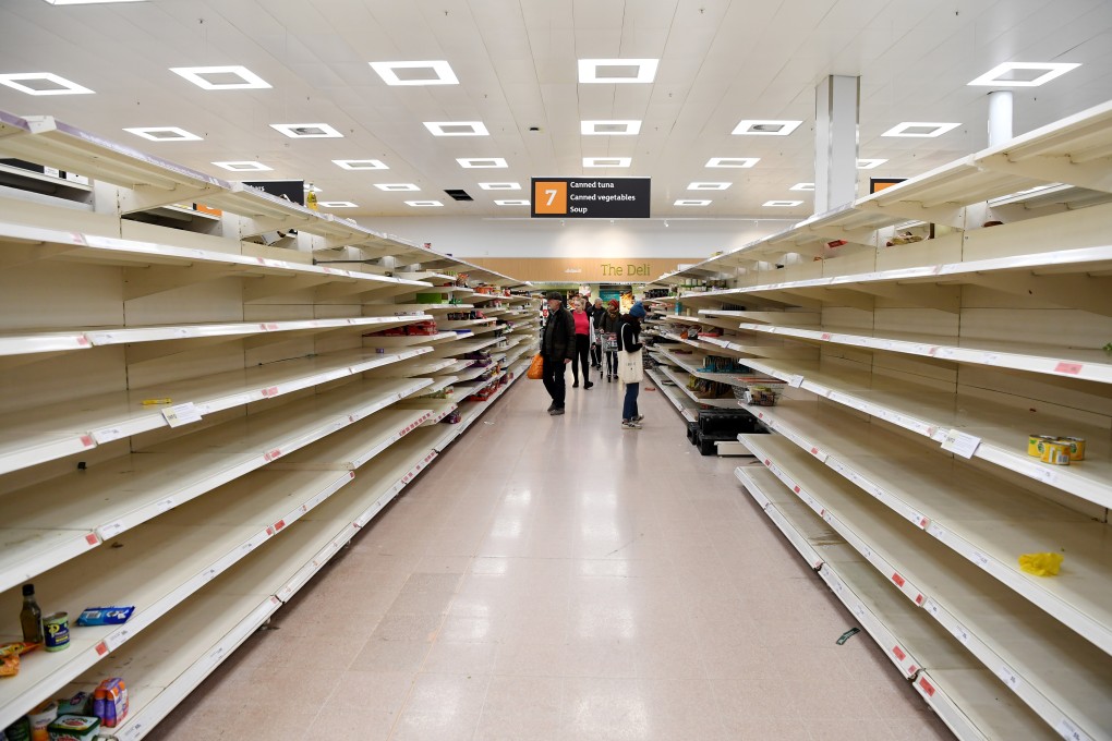Empty shelves in a London supermarket on March 19. Major British supermarkets have requested police protection over fears that coronavirus panic buying could lead to rioting. Photo: EPA-EFE