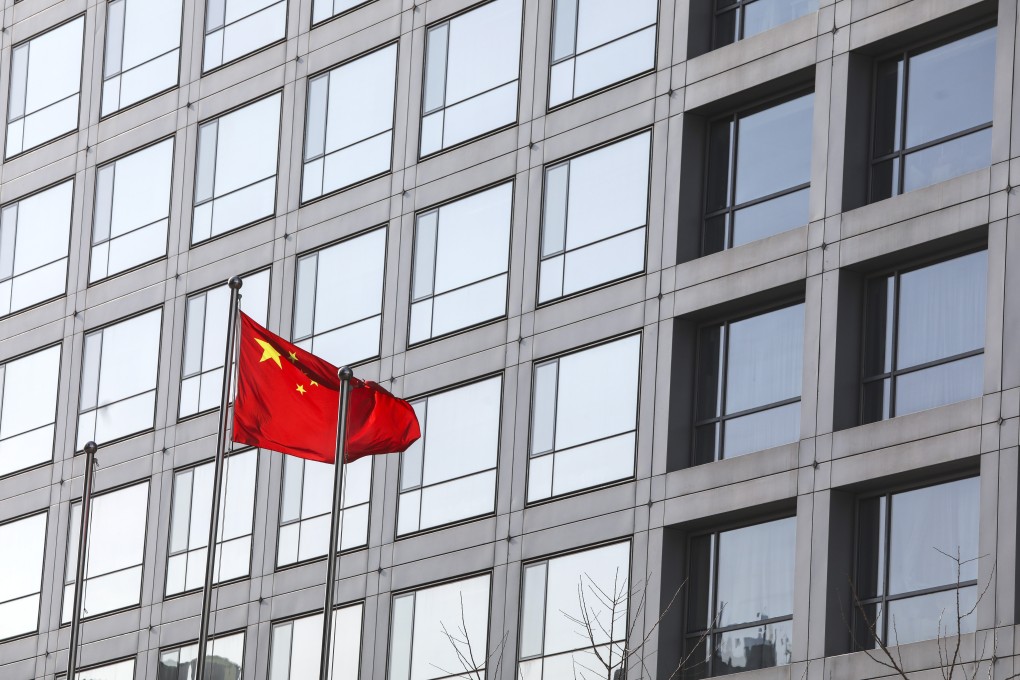 A Chinese flag flies outside the China Securities Regulatory Commission office in Beijing. A top official at the regulator has said that the effect of the global sell-off on mainland stocks would be temporary. Photo: Simon Song