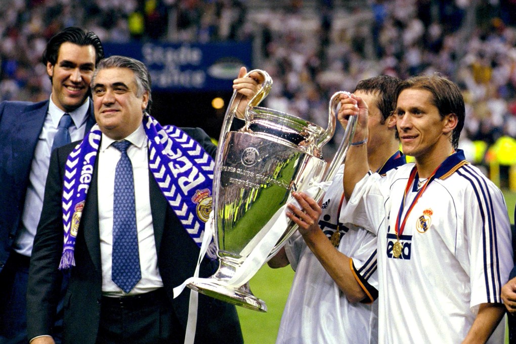 Lorenzo Sanz, the Real Madrid President holds the UEFA Champions League trophy with his nephew Michel Salgado. Sanz died of coronavirus in Spain. Photo: Reuters