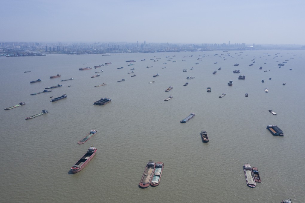 Barges and freight carriers are moored in the Yangtze River, near Nantong, Jiangsu province, on March 24. The dismal Chinese economic data for January and February made even the most pessimistic projection look optimistic. Photo: Bloomberg