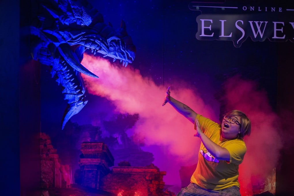 A woman is photographed in a game booth during last year’s Electronic Entertainment Expo held in Los Angeles, California, in June. This year’s edition of the world’s premier video game trade show was cancelled on March 11 over concerns about the coronavirus pandemic. Photo: Agence France-Presse