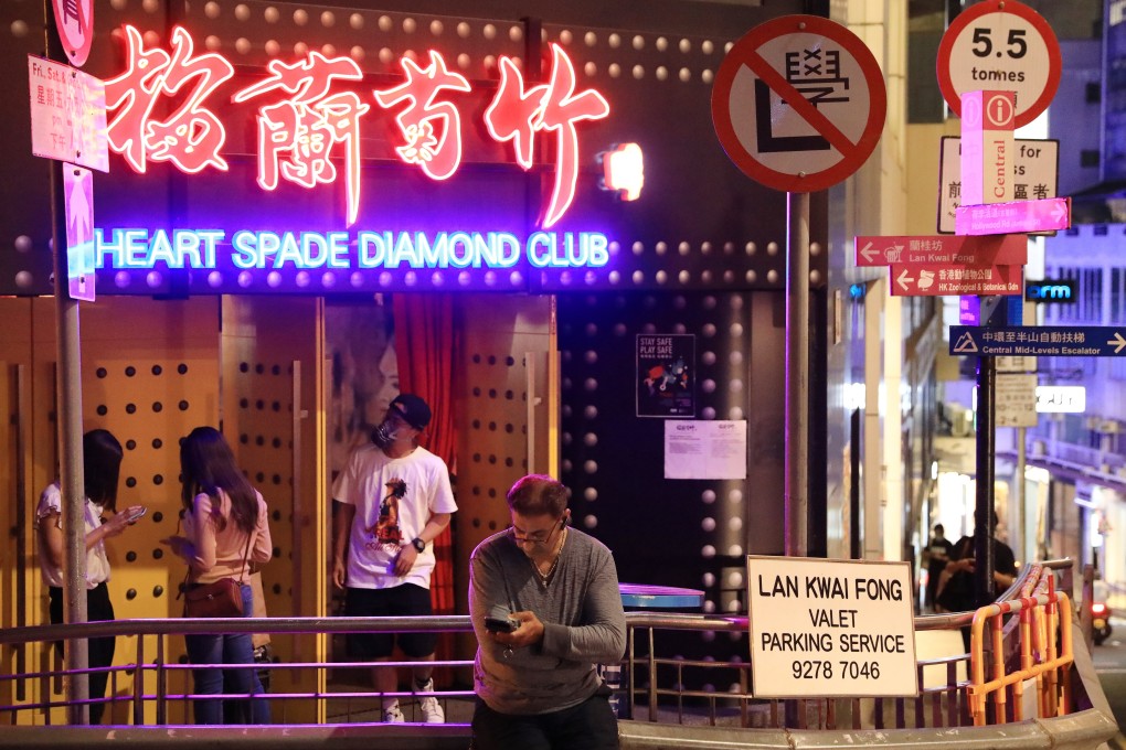 A patron at a bar at Lan Kwai Fong in Central, amid the coronavirus outbreak. Photo: May Tse