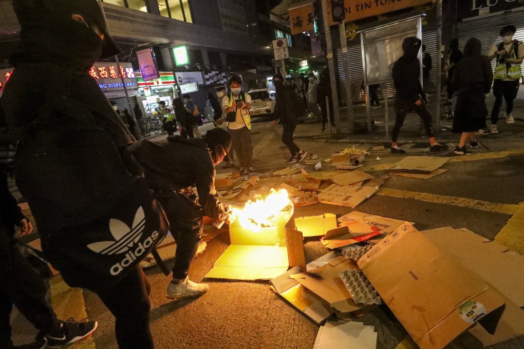 A barricade set by demonstrators burns in Yuen Long during a protest in Yeun Long. Photo: Dickson Lee