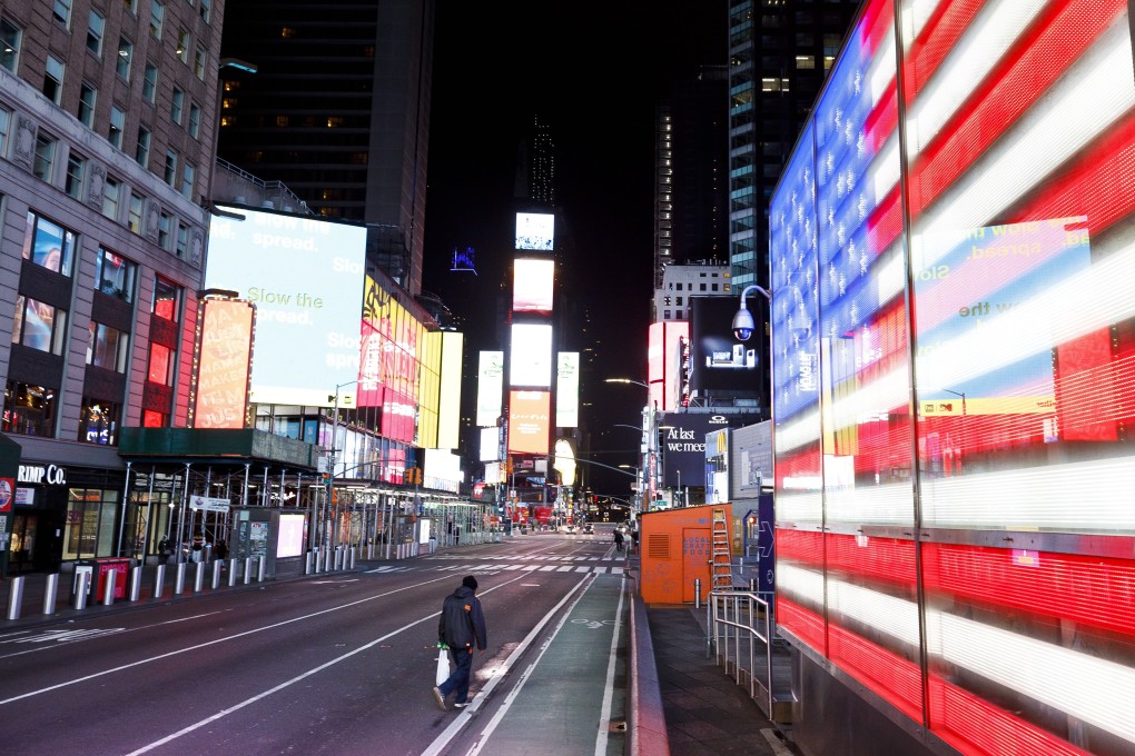 A person walks through a nearly empty Times Square in New York on March 25. Photo: EPA-EFE