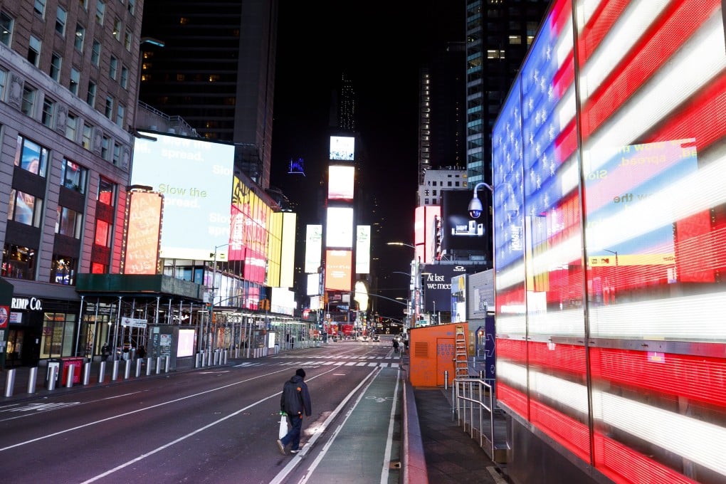 A person walks through a nearly empty Times Square in New York on March 25. Photo: EPA-EFE