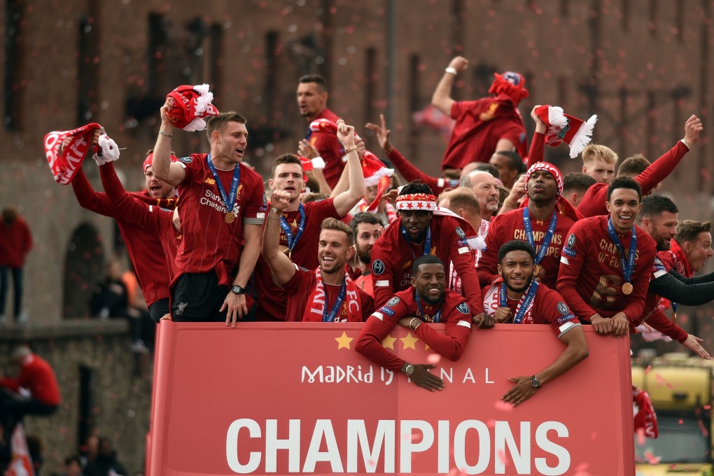 Liverpool players cheer the fans during an open-top bus parade around the city after winning the 2019 Uefa Champions League. Photo: AFP