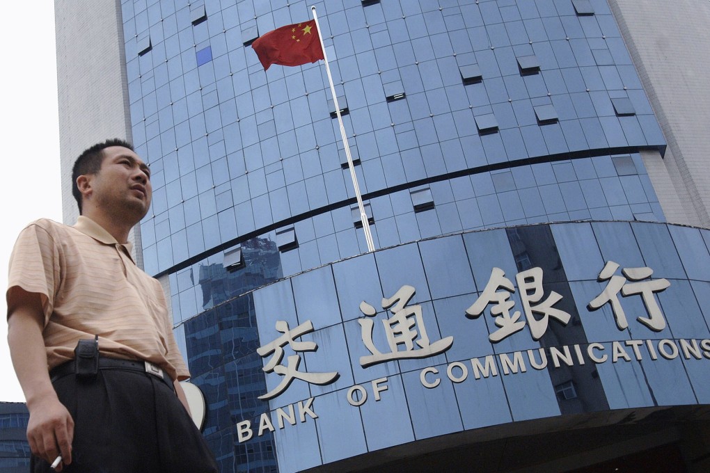 A man walks past a Bank of Communications branch in Hefei, in eastern China’s Anhui province. Photo: Reuters