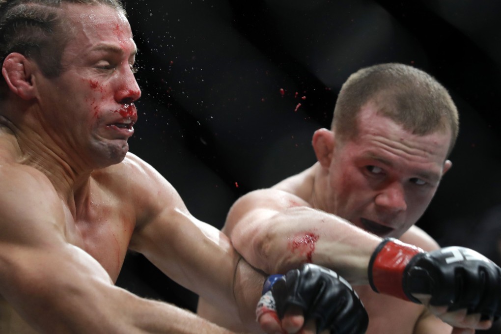 Russian bantamweight Petr Yan hits Urijah Faber with a right hook at UFC 245 in Las Vegas last December. Photo: AFP
