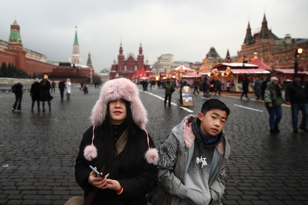 Chinese tourists in Red Square, Moscow. Photo: Sergei Bobylev\Tass via Getty Images