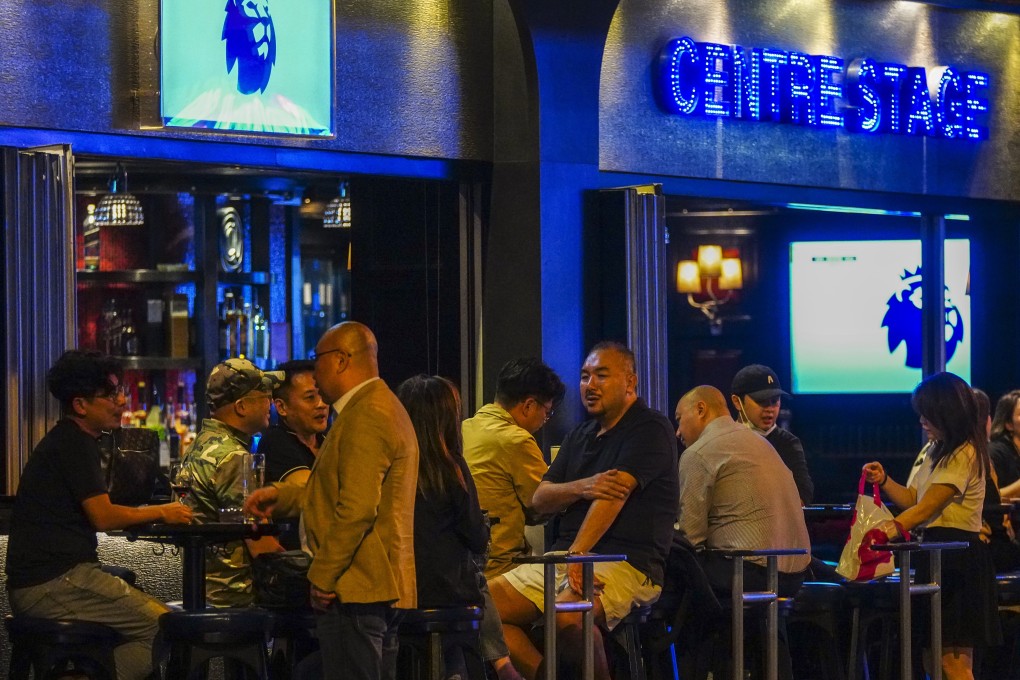 Customers drink at the Centre Stage bar in Wan Chai following the Covid-19 outbreak. Photo: Sam Tsang