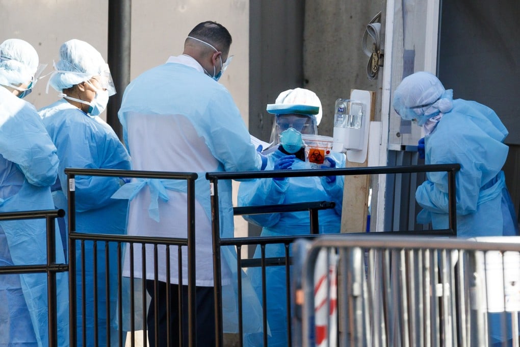 Medical professionals work at a coronavirus testing tent at the Brooklyn Hospital Centre in New York on Thursday. Photo: EPA-EFE
