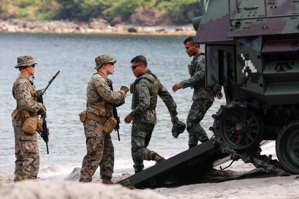 Philippine Marines (R) come out of an amphibious assault vehicle during a joint military exercise with their US counterparts in October 2019. Photo: EPA-EFE