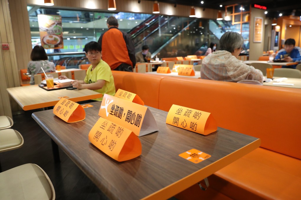 Placeholders on tables at a restaurant in Hong Kong encouraging social distancing. Photo: Edmond So