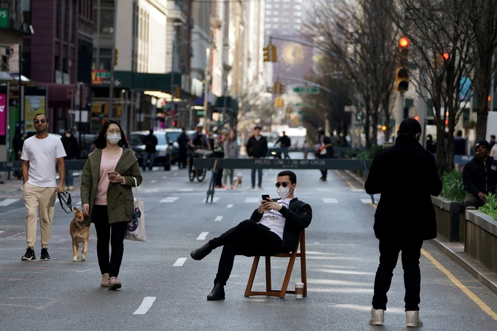A man sits on a chair in the middle of Park Avenue after it was closed to vehicular traffic amid New York’s coronavirus outbreak. Photo: Reuters