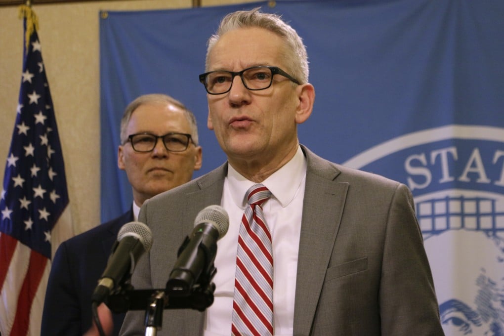 Washington state Health Secretary John Wiesman gives an update on coronavirus in the state as Washington Governor Jay Inslee looks on. Photo: AP