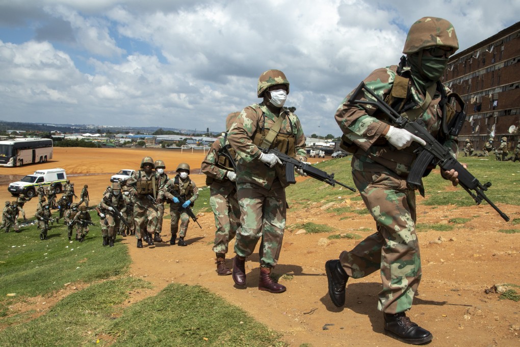 South African National Defence Forces pictured enforcing the country’s coronavirus lockdown in Johannesburg on Saturday. Photo: AP