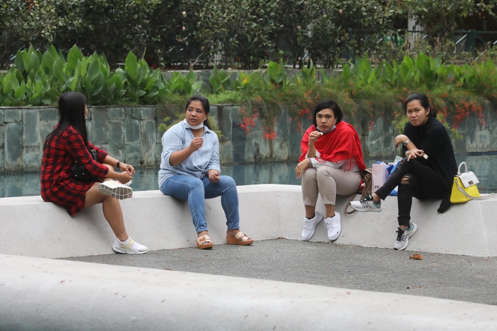 Domestic helpers enjoy their Sunday in Central under the first day of the new social-distancing laws. Photo: Dickson Lee