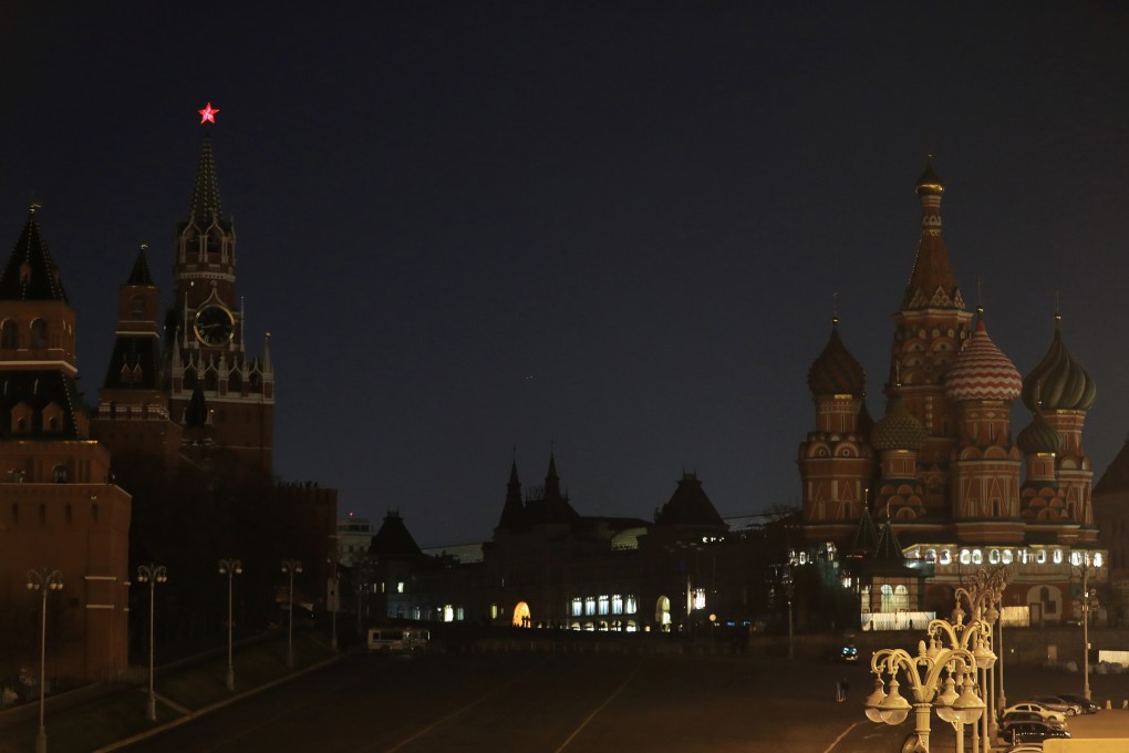 The Kremlin towers, the GUM department store and the St Basil’s Cathedral after the lights are switched off for Earth Hour in Moscow. Photo: Reuters
