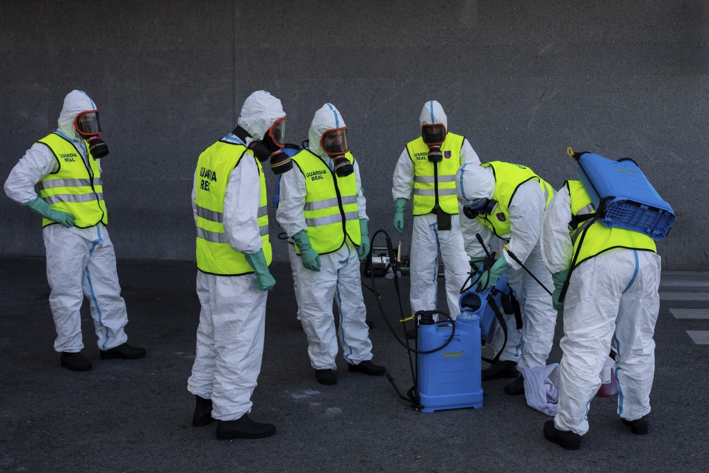 Spanish soldiers disinfect a hospital to prevent the spread of the new coronavirus in Madrid. Spain and Italy demanded more European help as they fight still-surging coronavirus infections. Photo: AP