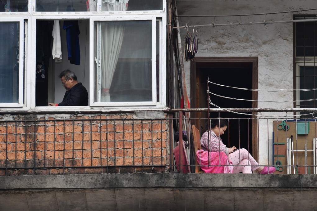 Wuhan residents use their smartphones while at home in this file photo dated March 10, 2020. Amid the coronavirus health crisis, physical and mental health care apps have become more popular. Photo: Reuters