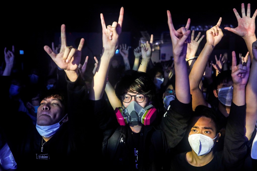 Fans wear masks to a concert at the venue, Hidden Agenda: This Town Needs, on February 27 amid a coronavirus outbreak. Photo: Reuters