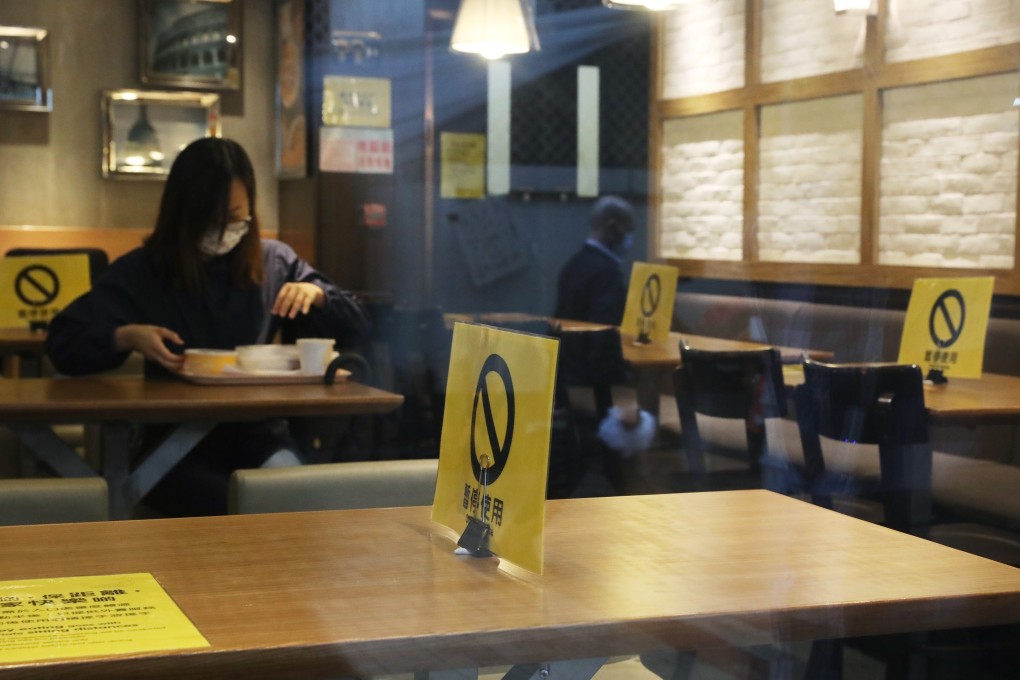 Diners at a restaurant in Kwun Tong, Hong Kong under the new social distancing regulations. Photo: K. Y. Cheng
