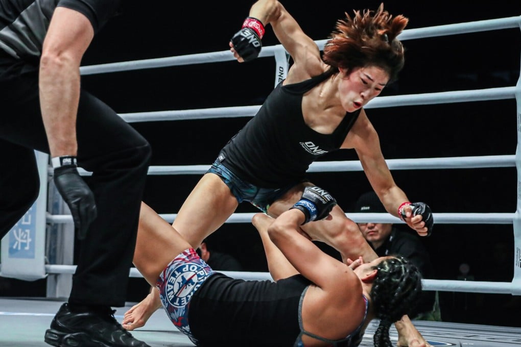 China’s Meng Bo throws punches down on Laura Balin. Photos: One Championship