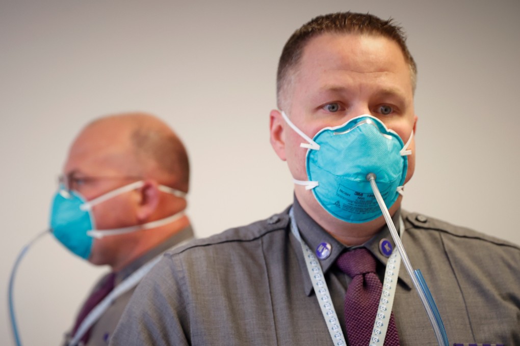New York State Police Troopers being fitted for N95 protective masks. Photo: Reuters