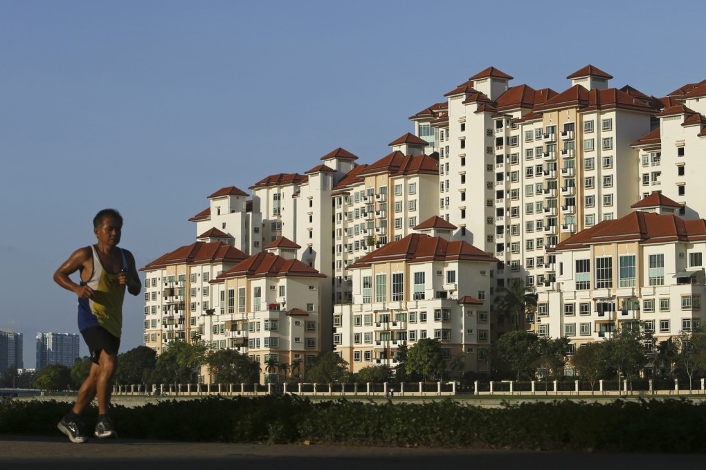 A man jogs past blocks of private flats at Tanjong Rhu in Singapore. Photo: Reuters