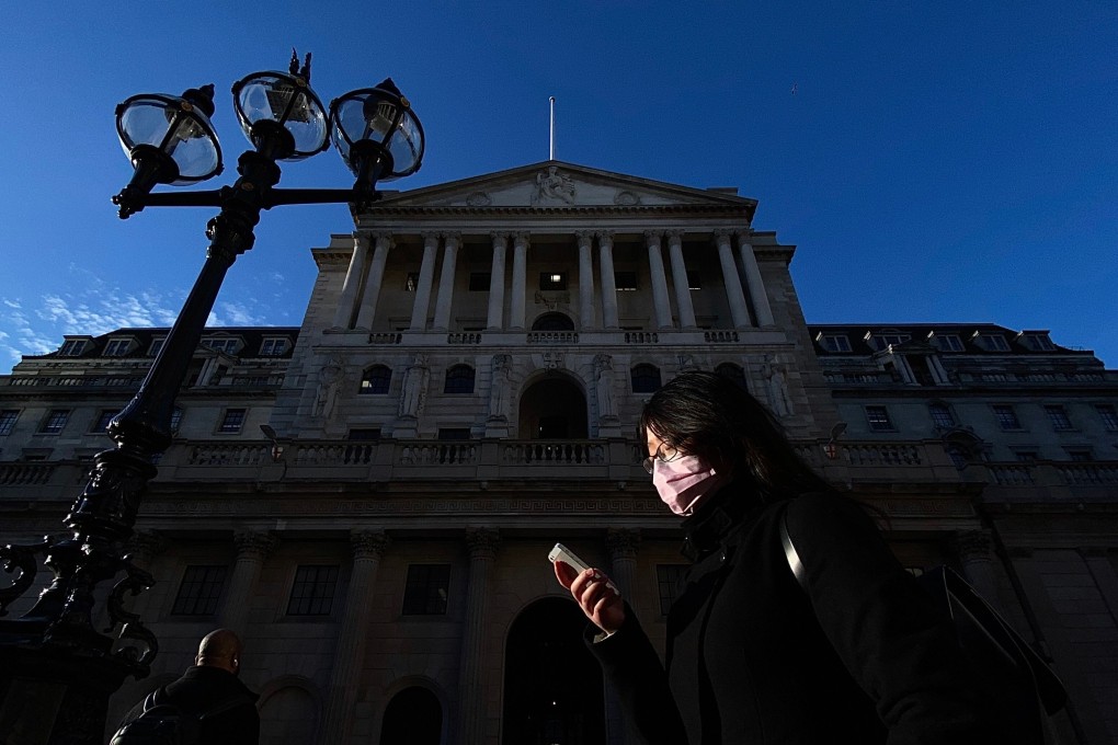 Dark times: a pedestrian passes the Bank of England during the coronavirus lockdown. Photo: AFP