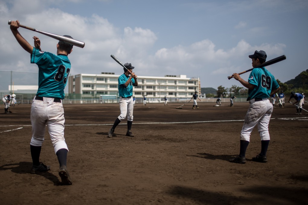Players from Yokohama Minami warm up before the start of a practice game between the Shonan Boys and the Yokohama Minami in Yokosuka, Japan. Baseball is hugely popular today in Japan. Photo: Getty Images