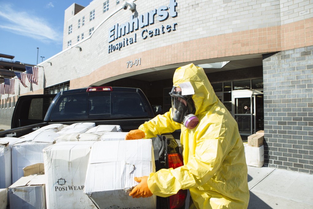 A worker distributes protective equipment to the Elmhurst Hospital Centre in the Queens borough of New York, US, on March 26, 2020. Photo: Bloomberg