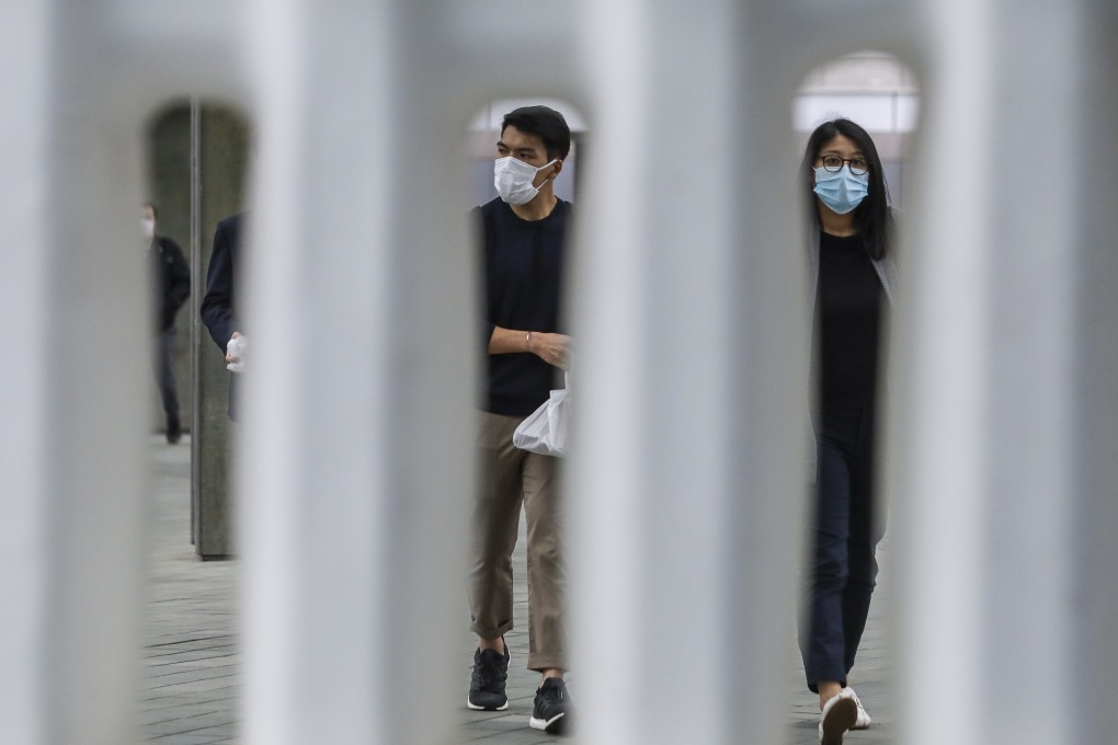 People on a footbridge outside the government headquarters in Tamar. Photo: Sam Tsang