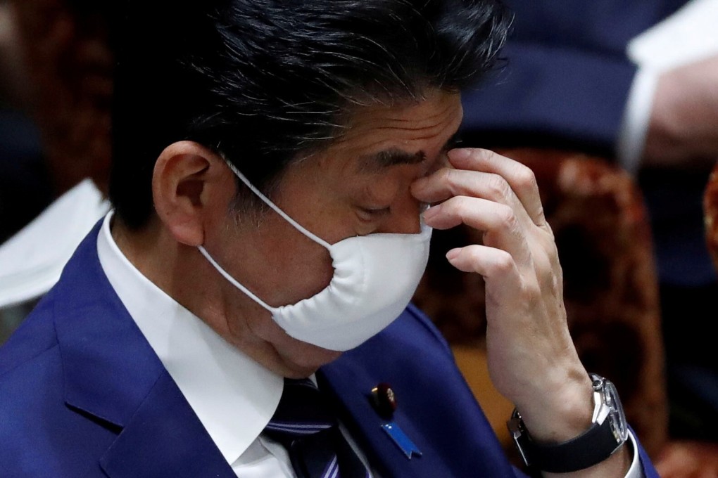 Japan's Prime Minister Shinzo Abe wearing a protective cloth face mask in parliament on Wednesday. Photo: Reuters