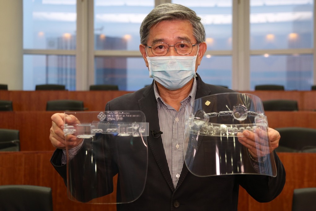 Man Hau-chung, dean of the engineering faculty at Polytechnic University, with the two types of mask it has designed. Photo: PolyU