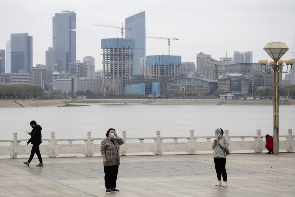 Residents observe social distancing at a park along the Yangtze River in Wuhan on Wednesday. Photo: AP