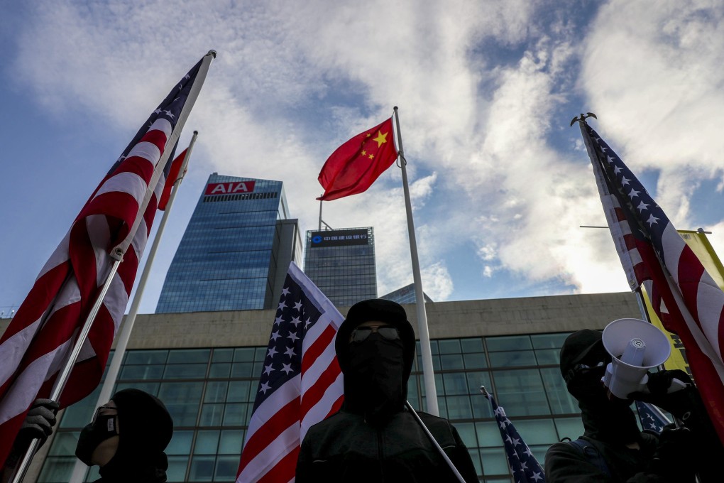 Pro-democracy protesters attend a rally in the Central district of Hong Kong on January 12, calling on foreign governments to sanction the Chinese government if universal suffrage is not implemented in Hong Kong. Photo: Sam Tsang