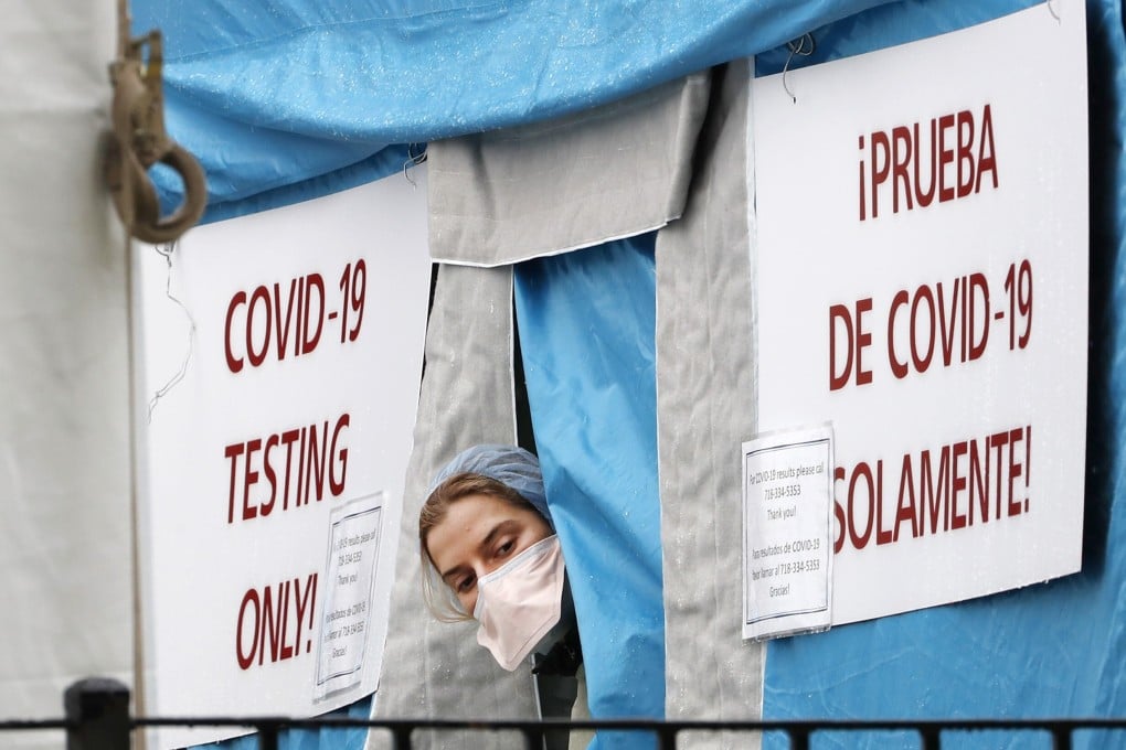 A medical worker at a Covid-19 testing tent in New York on Saturday. Photo: AP