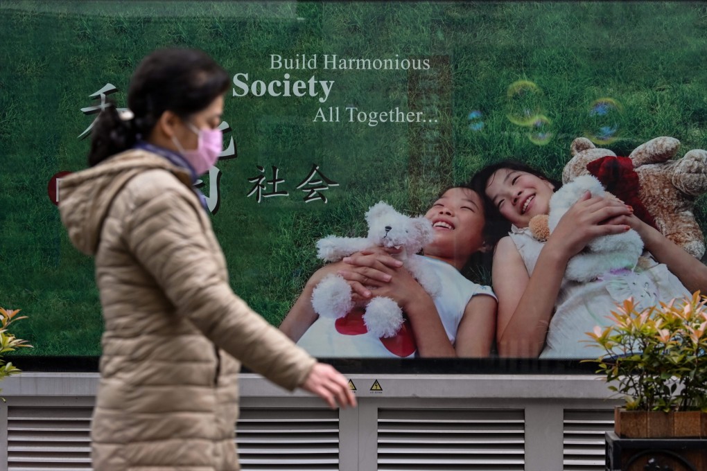 A woman wearing a face mask walks on a street in Wuhan, on April 2. The central Chinese city reopened on March 28 after more than two months of near-total isolation for its population of 11 million. Photo: AFP