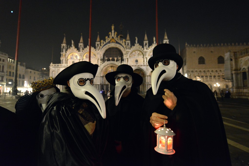 Revellers in the Plague Doctors Procession in Venice, Italy, last month, dressed up in face masks similar to those worn by plague doctors in the 17th century. Italy’s doctors are urged to prioritise those with greater survival chances and life expectancy. Photo: AFP