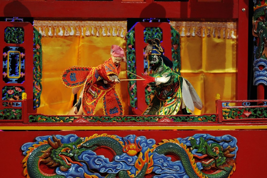 A traditional wayang potehi puppet show at Surabaya Culture Hall in Surabaya, Indonesia. The traditional art form is being revitalised by a performing arts group in Jakarta. Photo: Robertus Pudyanto/Getty Images