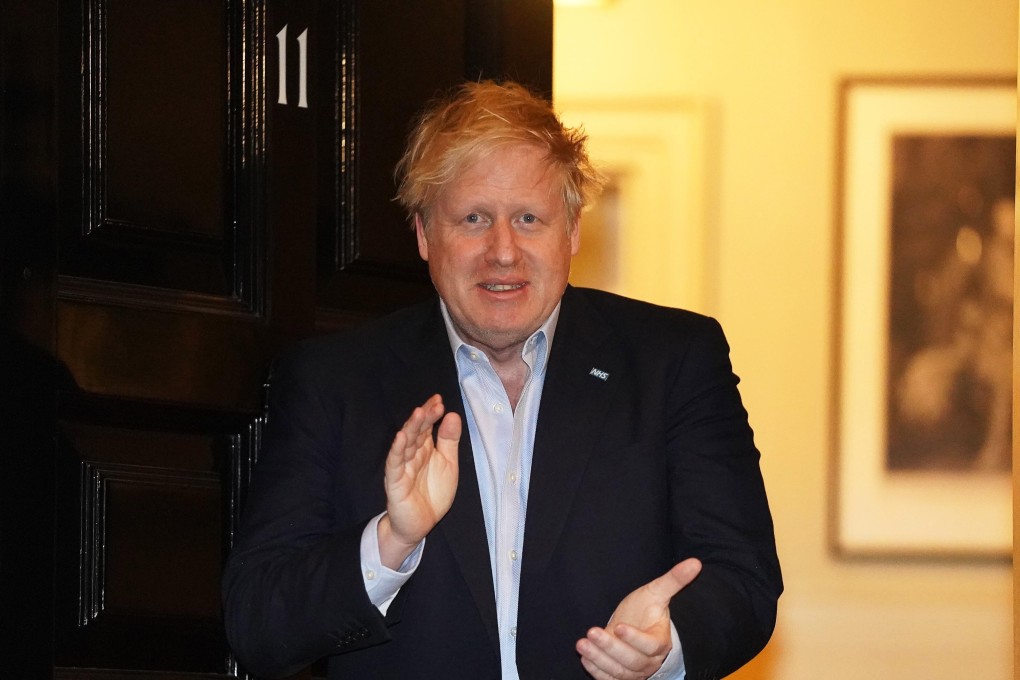 British Prime Minister Boris Johnson applauding health workers fighting the coronavirus pandemic in London. Photo: AP