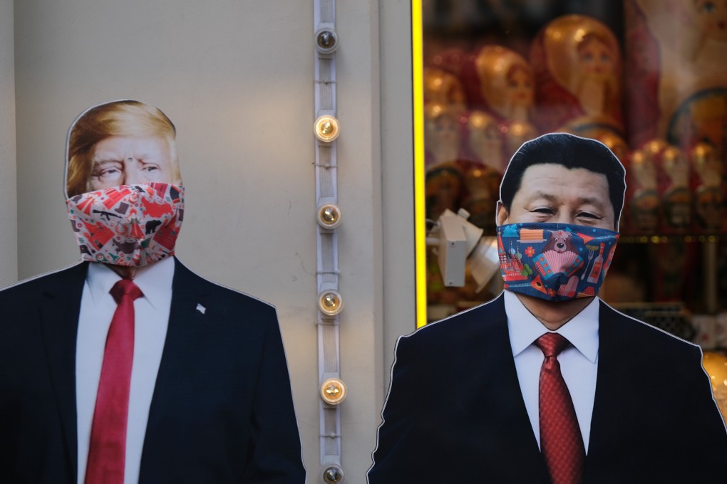 Cardboard cut-outs in Moscow last month depicting US President Donald Trump and Chinese President Xi Jinping wearing protective masks amid the coronavirus outbreak. Photo: Reuters
