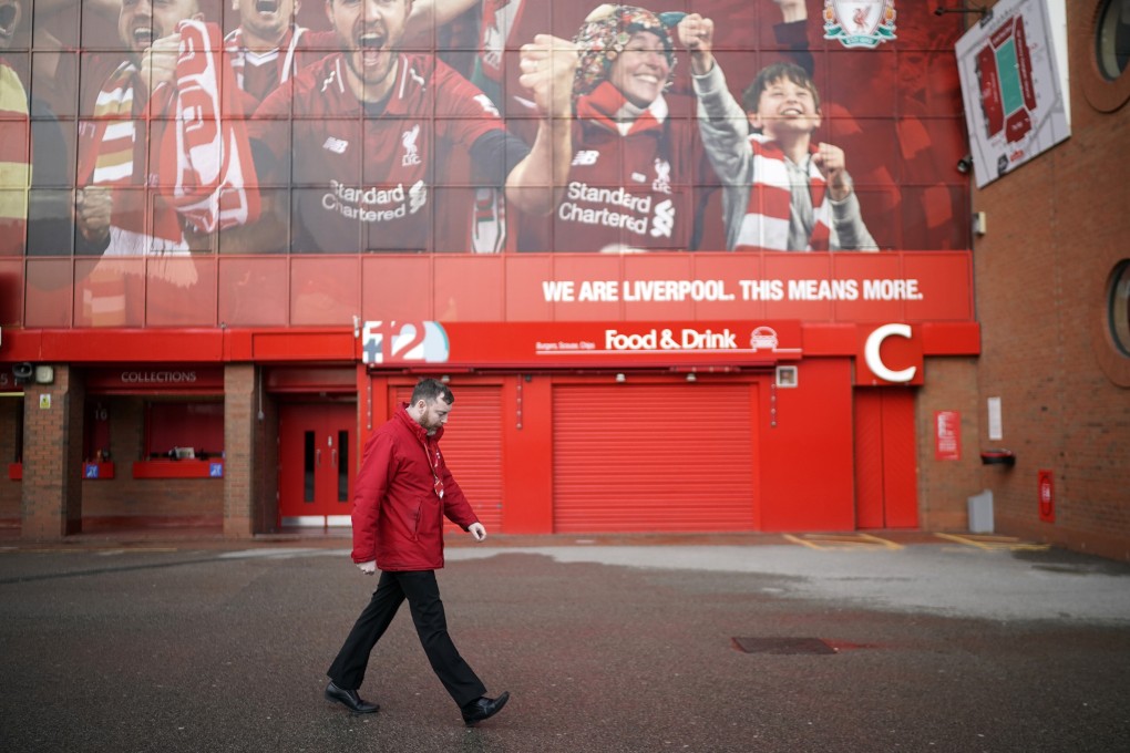 A non-playing staff member walks by Anfield. The public purse will be paying the majority of Liverpool’s non-playing staff member’s wages during the coronavirus crisis. Photo: Christopher Furlong/Getty Images