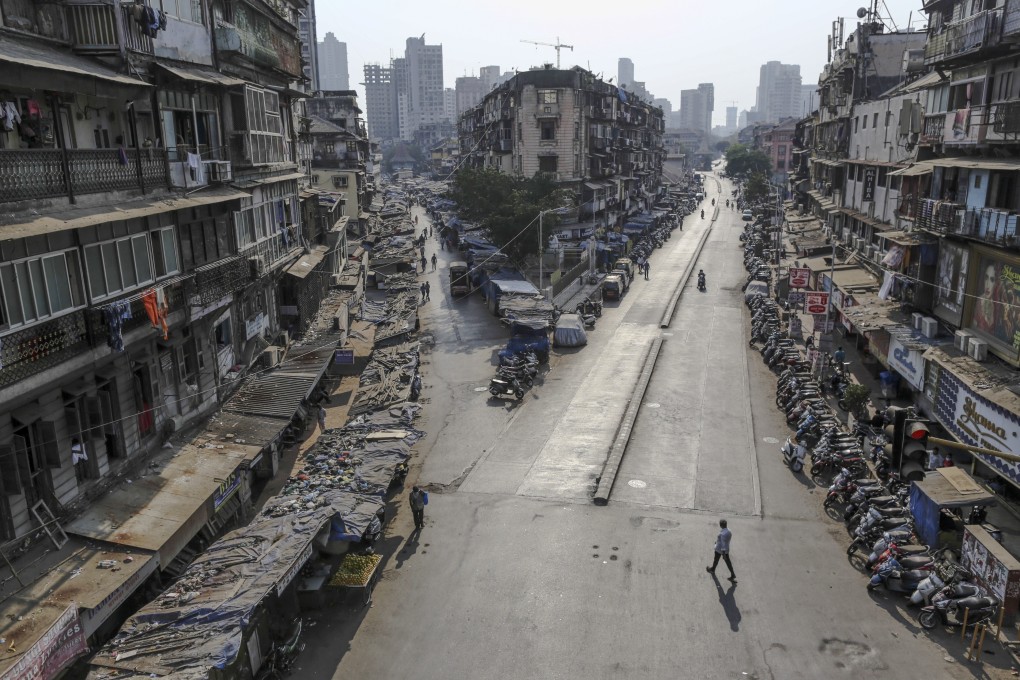 Pedestrians walk along near-empty roads during a lockdown imposed due to the coronavirus in Mumbai, India. Photo: Bloomberg