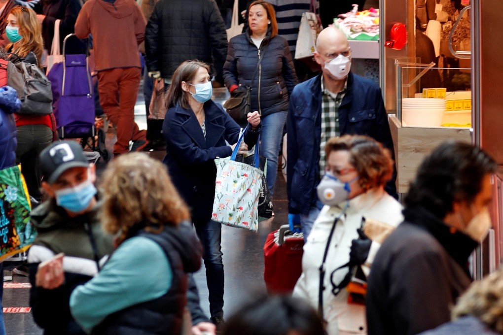People seen at a market in Barcelona, Spain, on April 4, 2020. Photo: EPA-EFE