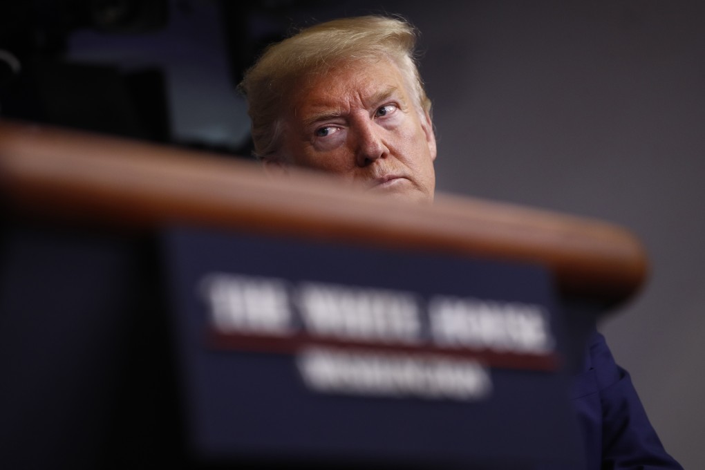 US President Donald Trump listens as the director of the National Institute of Allergy and Infectious Diseases, Anthony Fauci, speaks during a coronavirus task force briefing at the White House on Saturday. Photo: AP