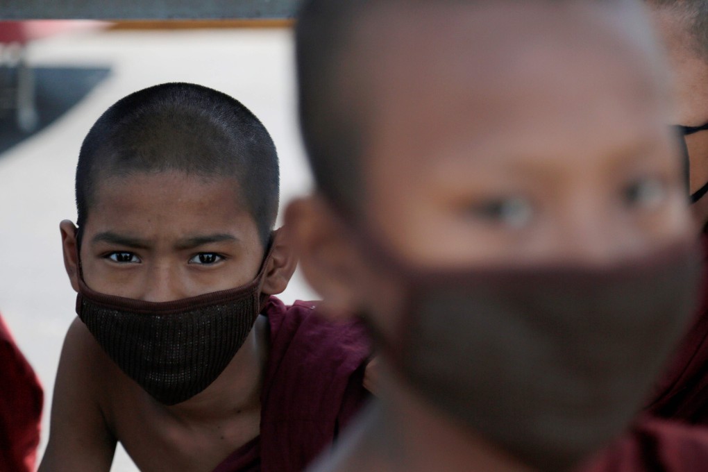 Young Buddhist monks wear face masks amid concerns over the spread of the coronavirus in Yangon. Photo: AFP