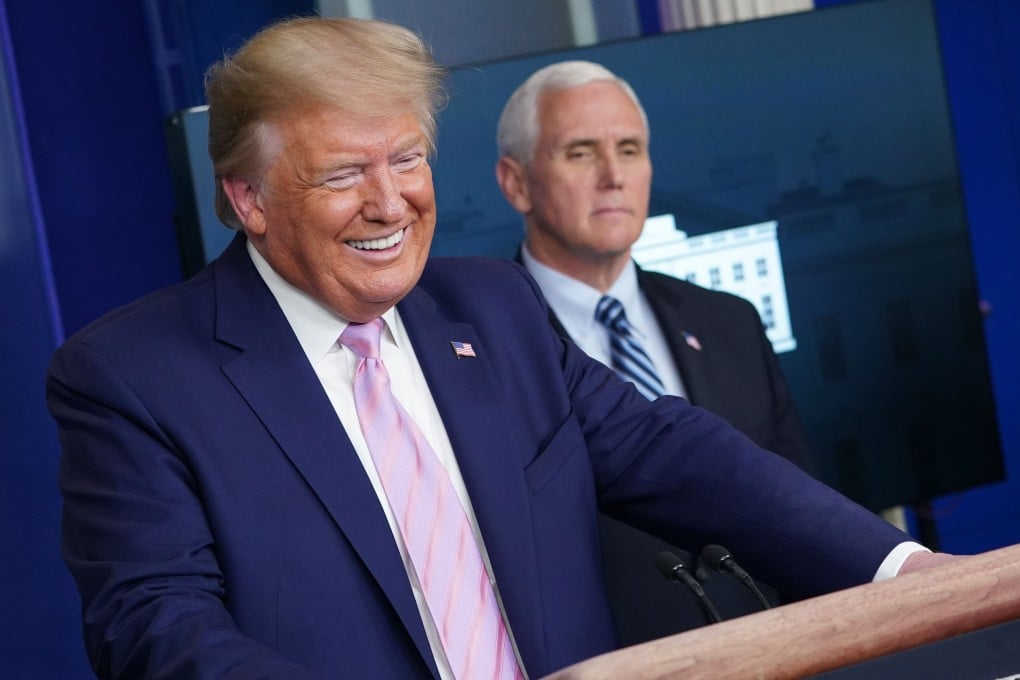 US President Donald Trump (with US Vice-President Mike Pence) speaks at a coronavirus briefing in the White House on Wednesday. Photo: AFP
